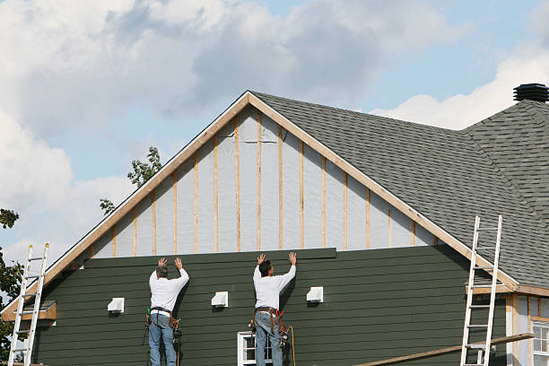 Professional Storm Damage Siding Repair technician working in Sterling, IL
